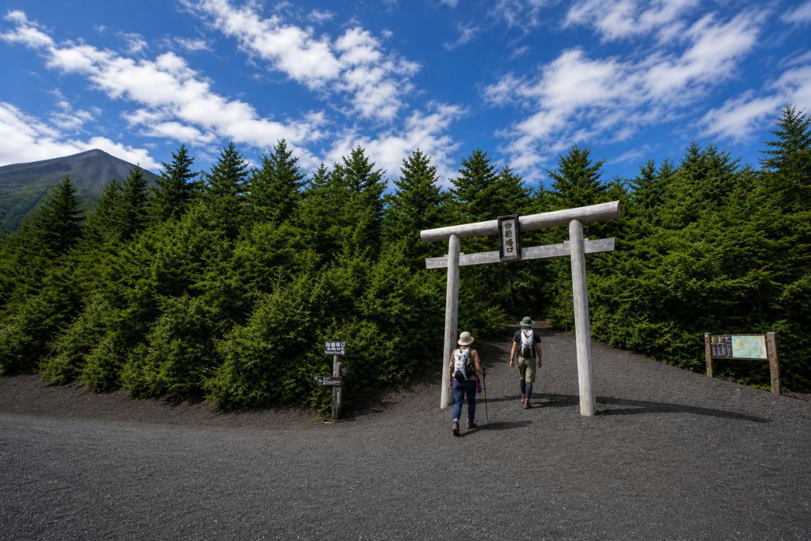 Hiking start point at Gotemba Trail with torii gate and forest landscape during a Mt. Fuji Tours tour with our agency